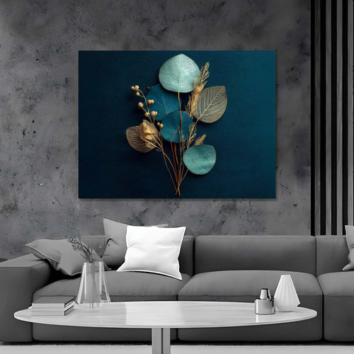 Decorative wall art with teal leaves and gold elements on a dark blue background