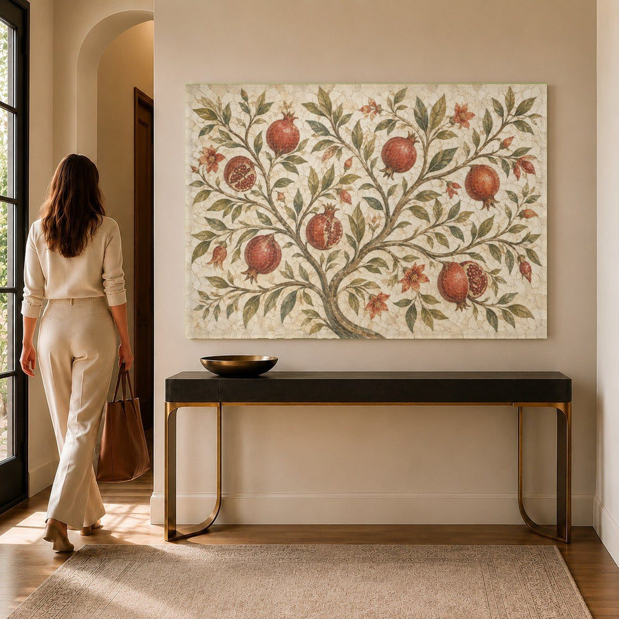 Detail shot of the glossy botanical tempered glass wall art featuring rich red pomegranates in a luxury dining room.