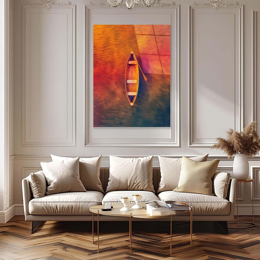 Modern living room with a sofa, coffee table, and framed artwork of a boat on water.