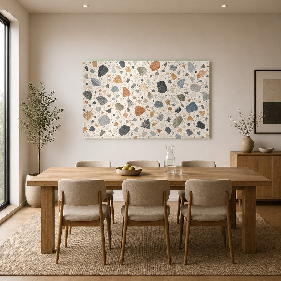 Vibrant Terrazzo Mosaic glass print mounted on a neutral bedroom wall above a king-size bed.