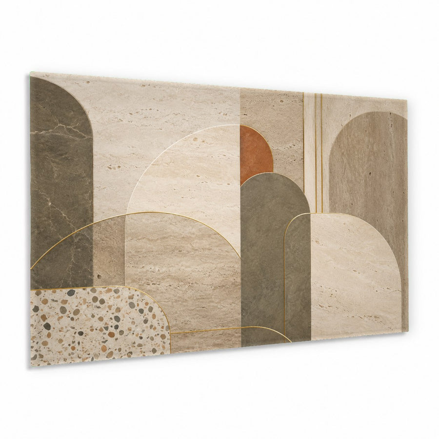 Modern abstract green and gold glass wall art hung above a gray velvet sofa in a contemporary living room.