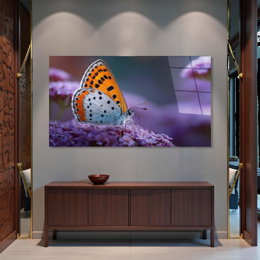 Butterfly on a flower displayed on a wall above a wooden cabinet.