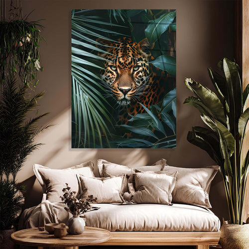 Leopard peeking through tropical leaves on a white background