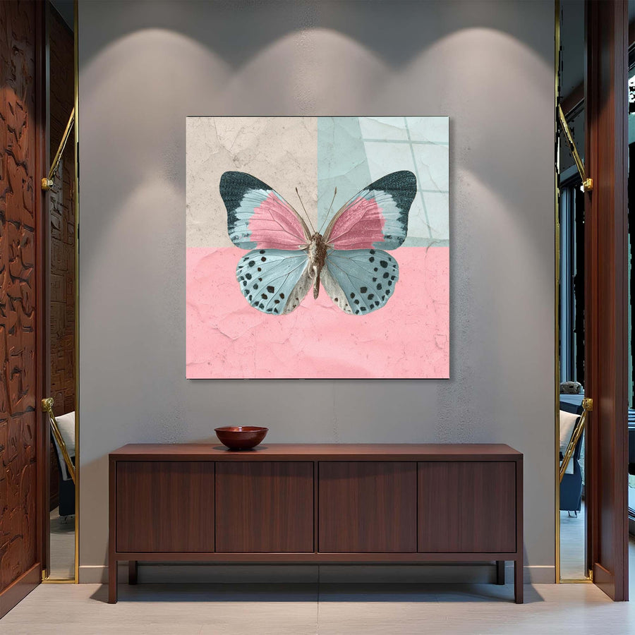 Butterfly artwork on a wall above a wooden cabinet