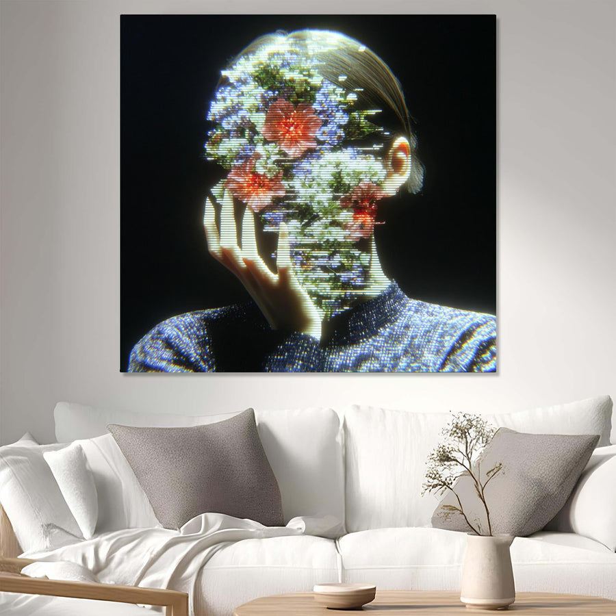 Abstract artwork of a person with floral elements displayed on a wall above a white sofa.