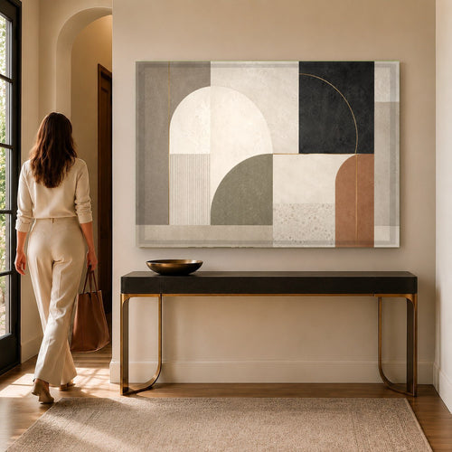 Modern living room featuring Urban Geometry glass wall art hanging above a sleek grey fabric sectional sofa.