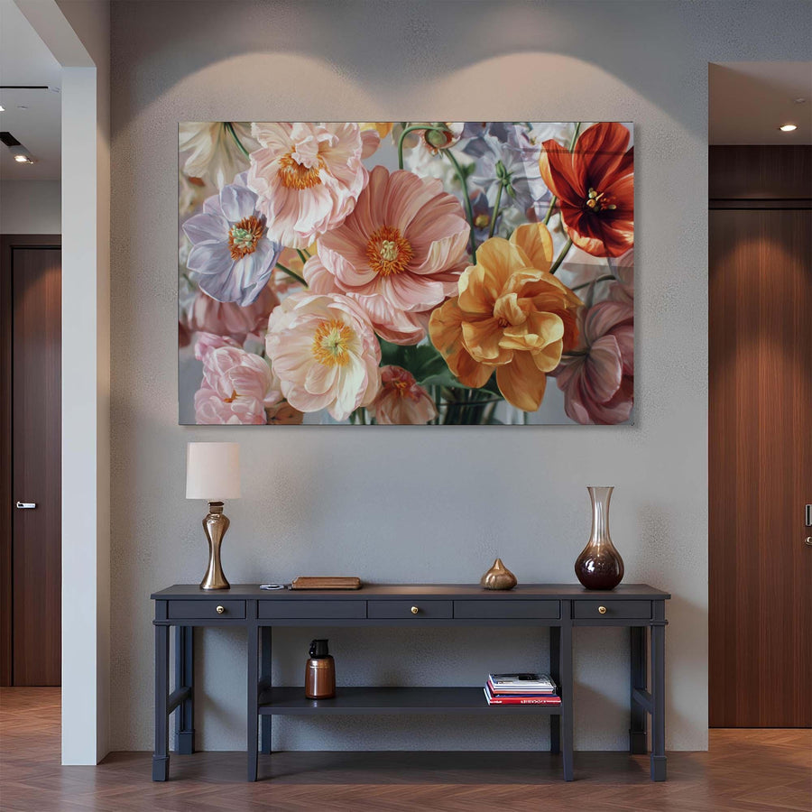 Floral painting above a console table in a room with wooden flooring and a gray wall.