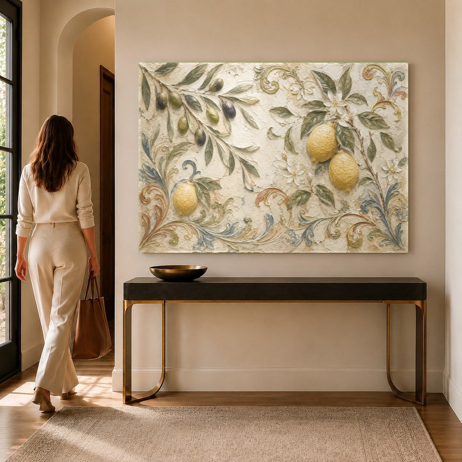 Close-up of a botanical glass print featuring vibrant lemons and green olive branches in a sunlit dining room.
