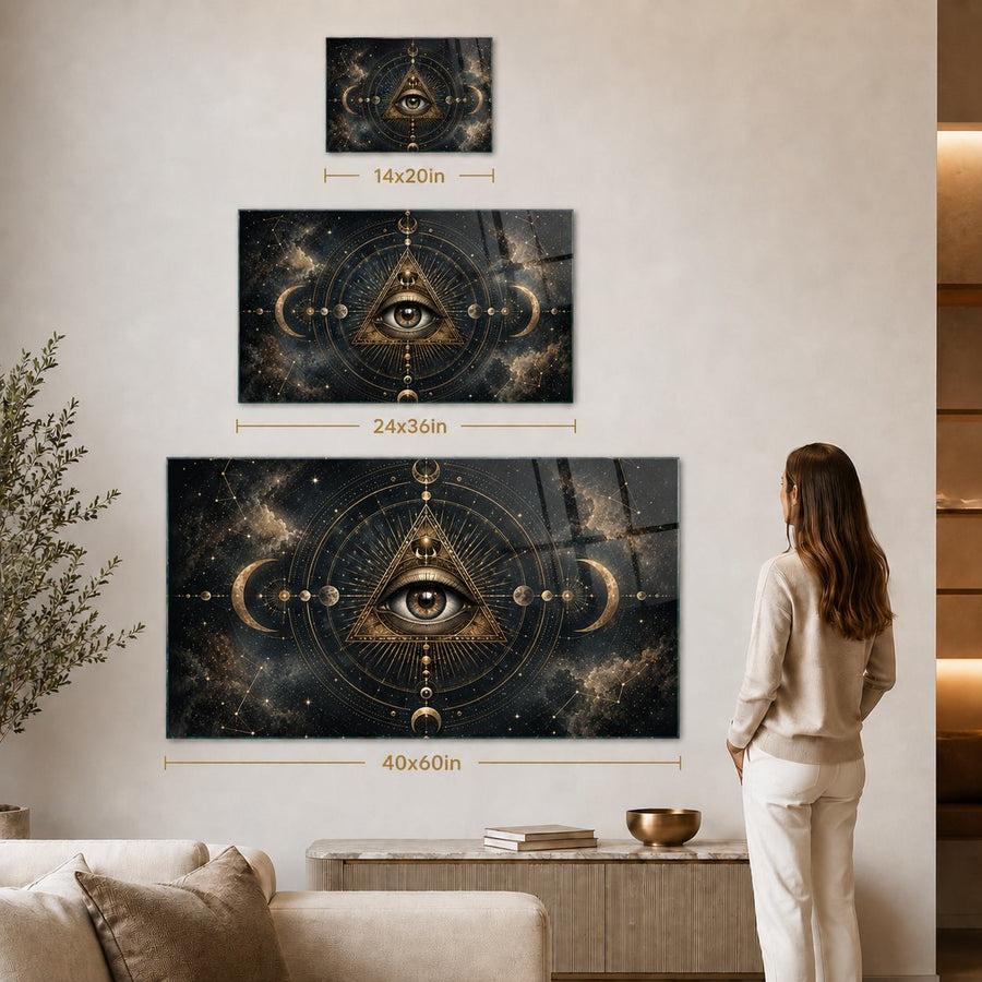 Three vertical wall art prints with all-seeing eye and celestial designs shown in a living room setting, with size annotations 14x20in, 24x36in, and 40x60in. A woman stands to the right of the largest print, and a sofa, plant, and side table are visible.
