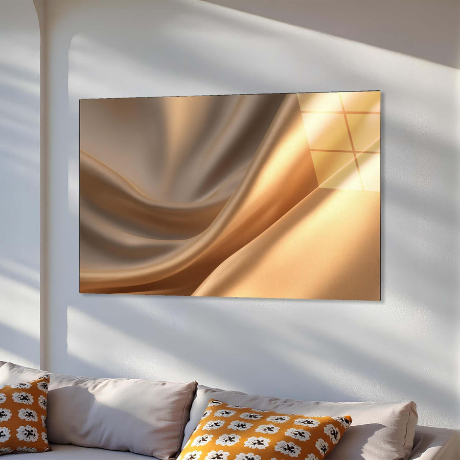 Abstract art piece on a wall above a sofa with decorative pillows.