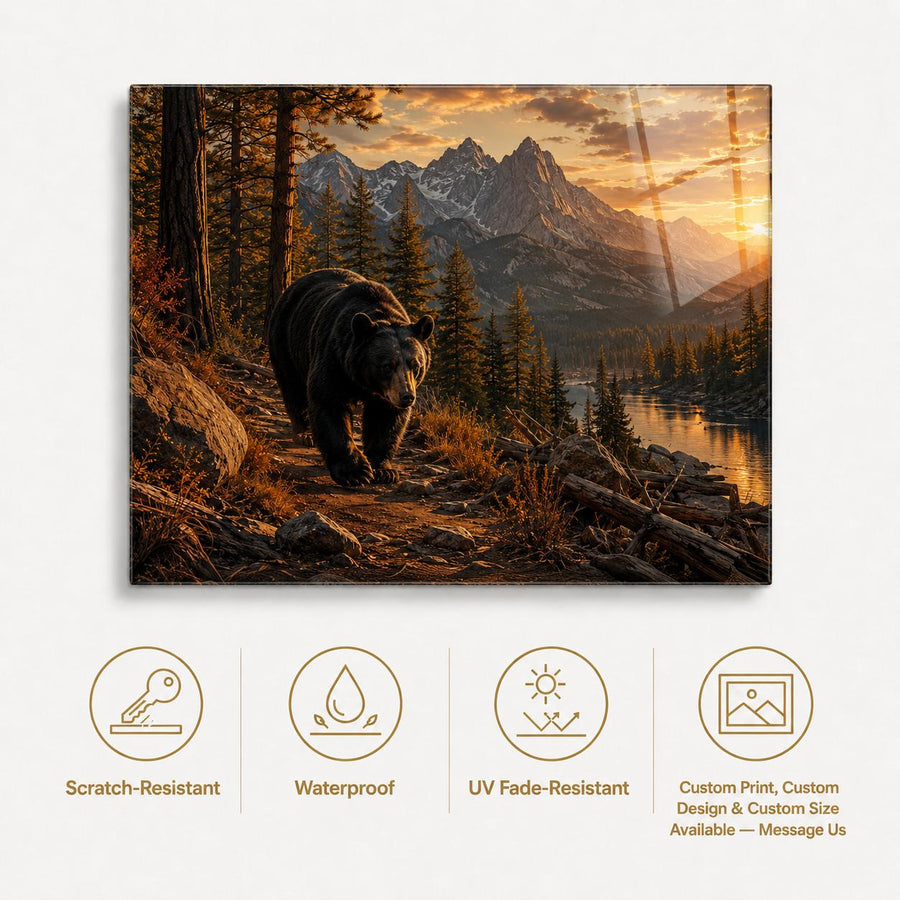 A rectangular wall art print or canvas showing a bear walking along a forest path toward mountains and a lake at sunset, displayed on a light background with feature icons below for scratch resistance, waterproofing, UV fade resistance, and custom print options.