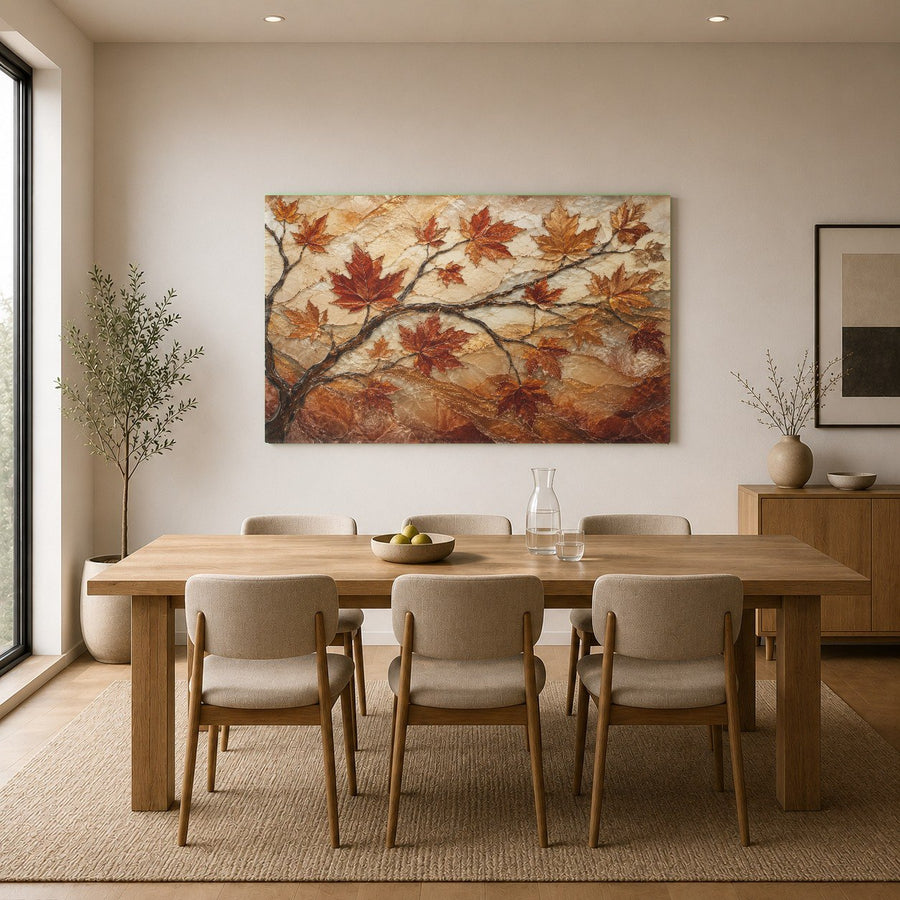 Close-up of a modern fireplace mantel with a colorful autumn leaves glass print hanging directly above.
