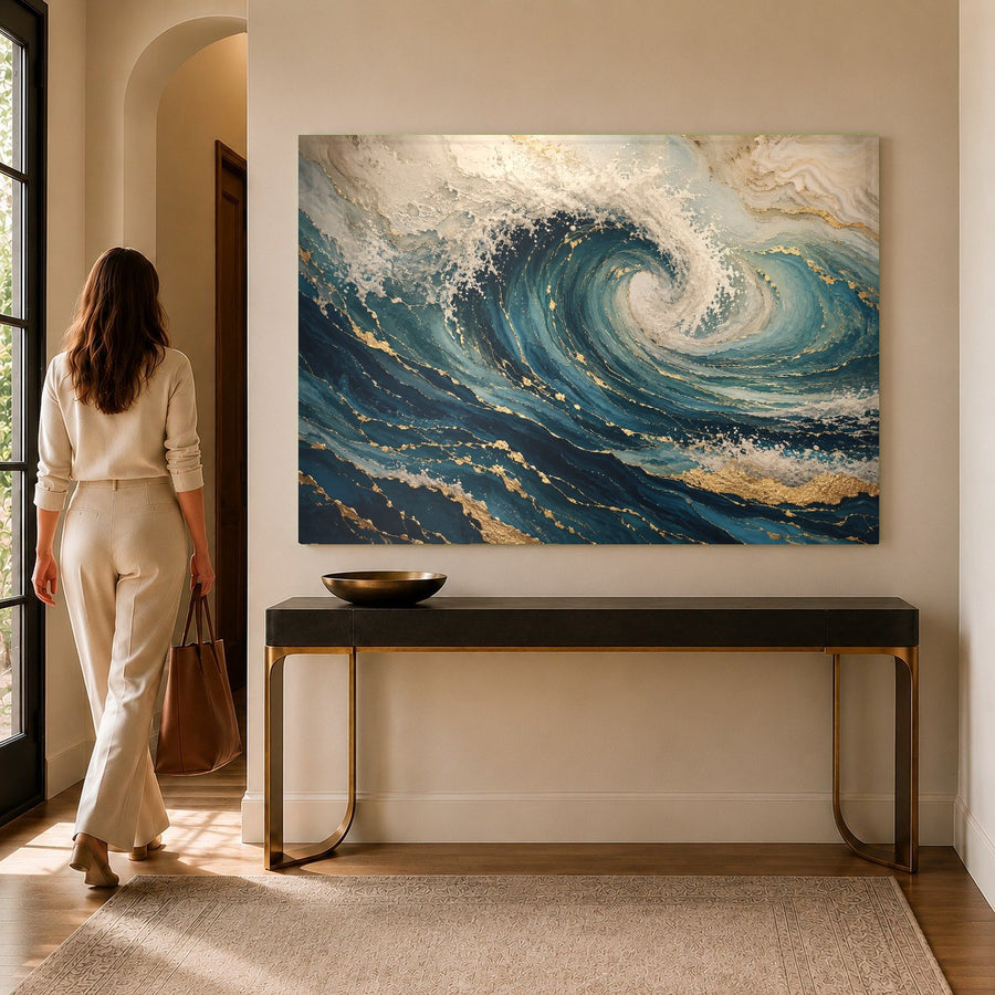 Close-up of the glossy surface of an ocean waves tempered glass print mounted on a textured sandy-beige wall.