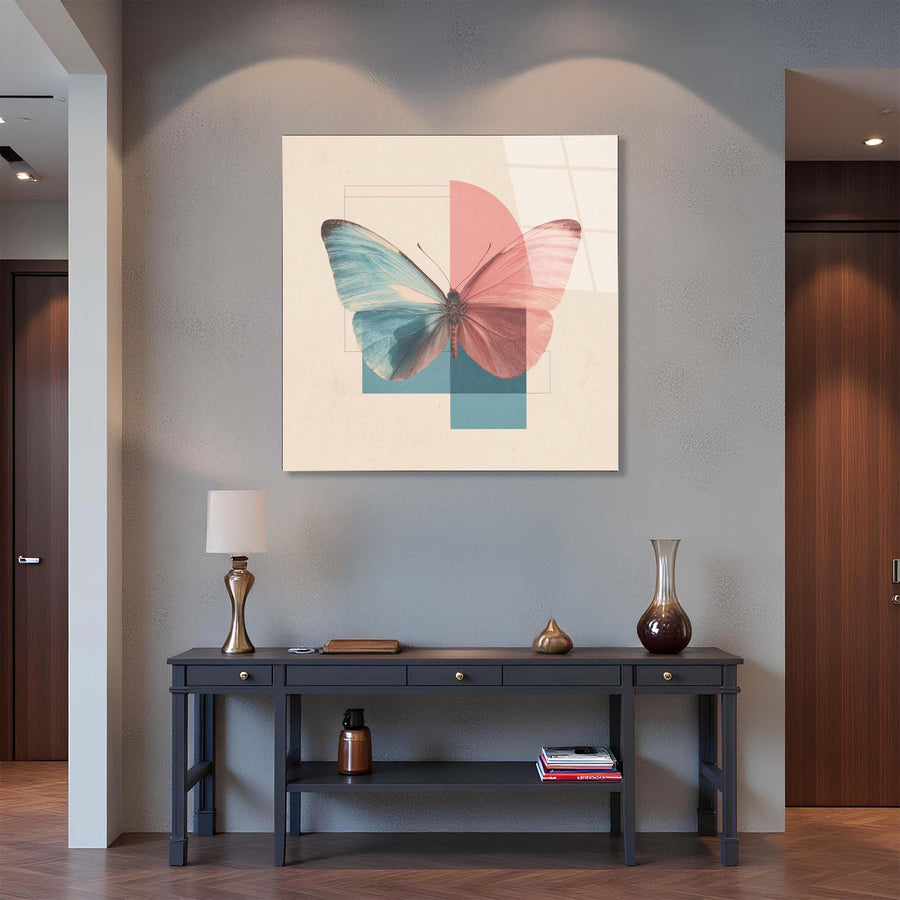 Framed butterfly artwork on a wall above a console table with decorative items.
