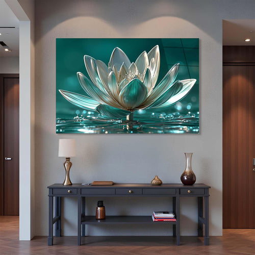 Glass sculpture of a lotus flower on a reflective water surface with a teal background